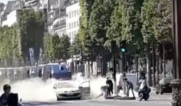 Car rams police van on Paris’ Champs Elysees, driver dead