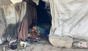 Palestinians displaced by the Israeli military offensive take shelter in tents near Gaza's seaport, in Gaza City May 26, 2025. 