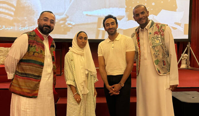 Psychologist Lujain Faqerah and actor Abdul Al-Shareef, center, with attendees at the drama therapy workshop in Jeddah. 